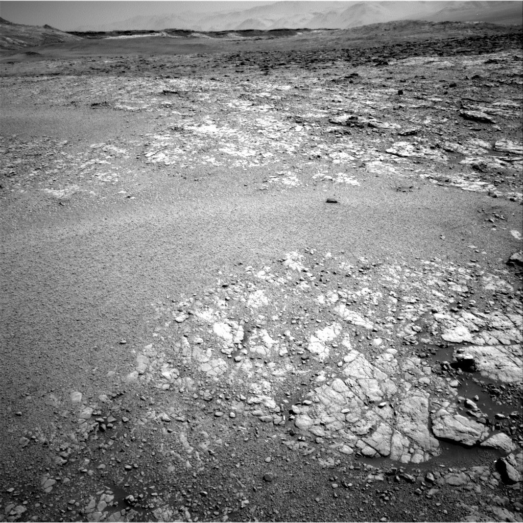 In this Navcam view, the smooth, granular surface of one of the “Culbin Sands” megaripples extends across the local bedrock.