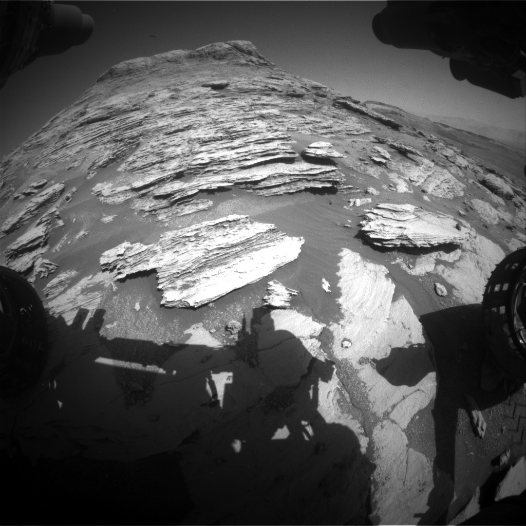 Front Hazcam image of the view out the front window with our current workspace in the foreground.