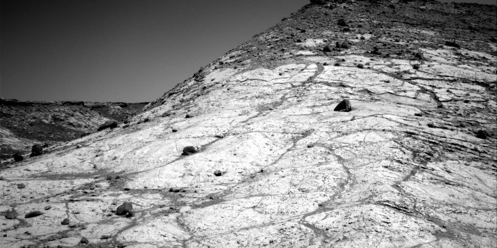 The slope steepens upward toward the top of Western Butte. We planned a drive that will end near the top of the light-colored bedrock outcrop.