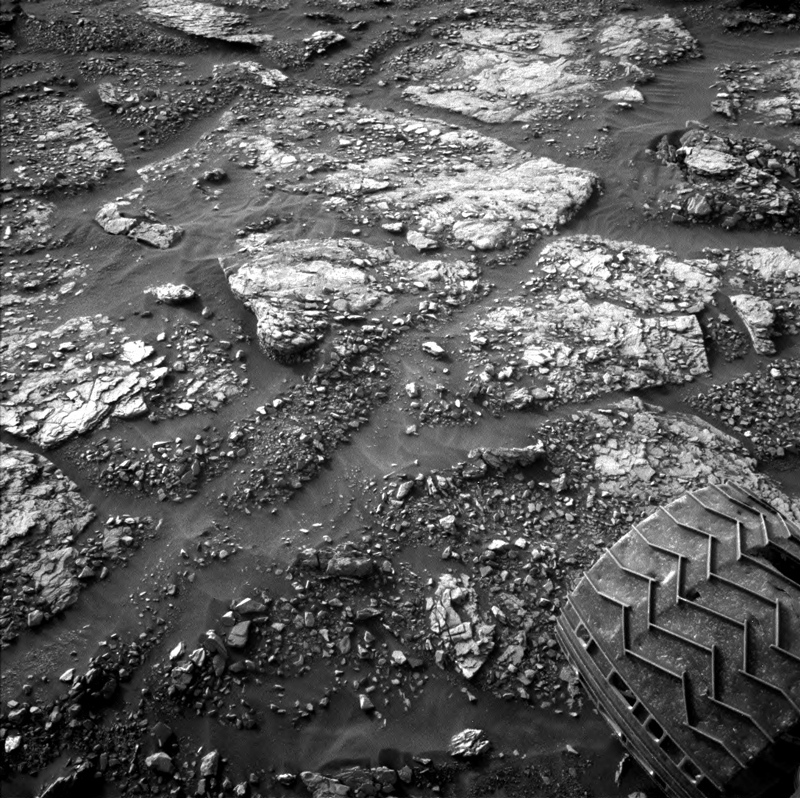 Curiosity's wheel is visible in this image of Mars