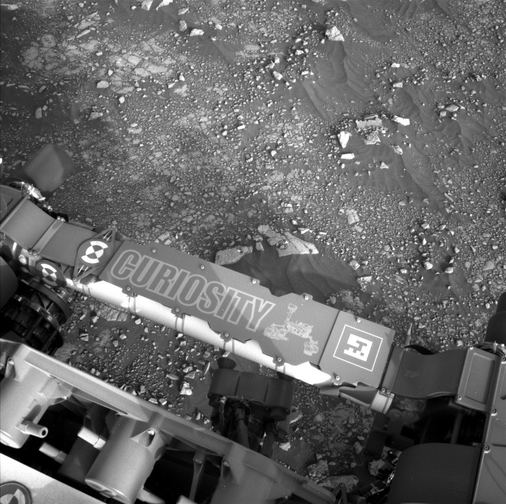 A part of the Curiosity rover is visible in this Mars image