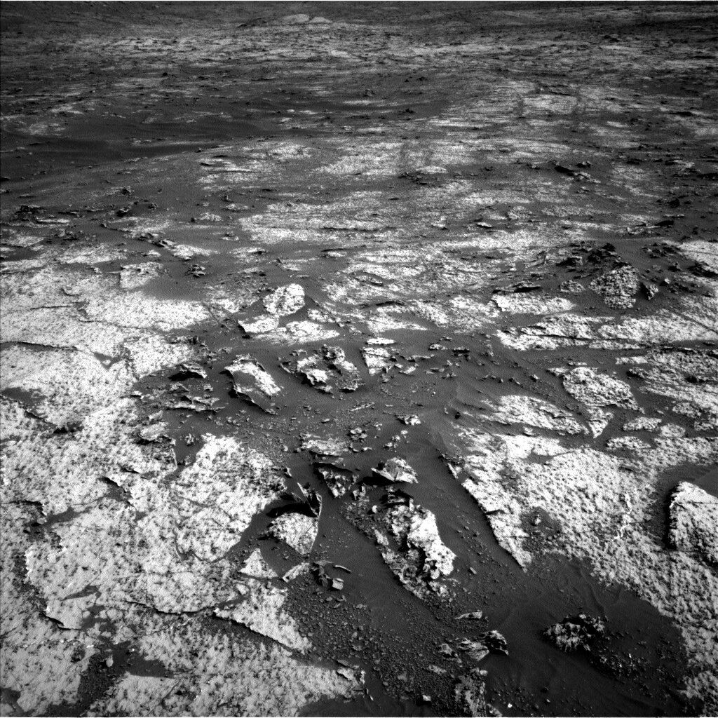 This is a black and white image of Mars' surface. 