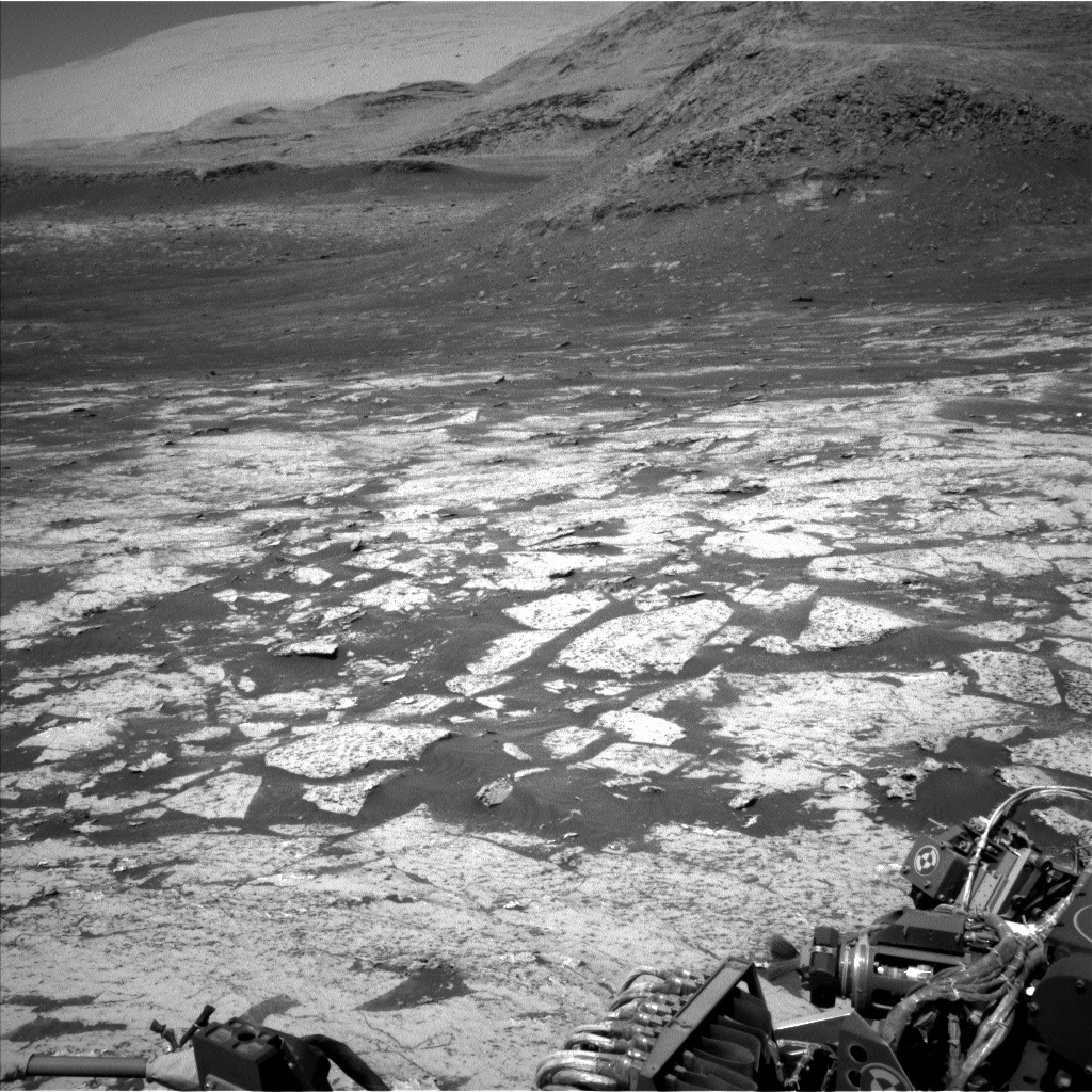 Black and white photo of Mars surface from Mars rover Curiosity. 