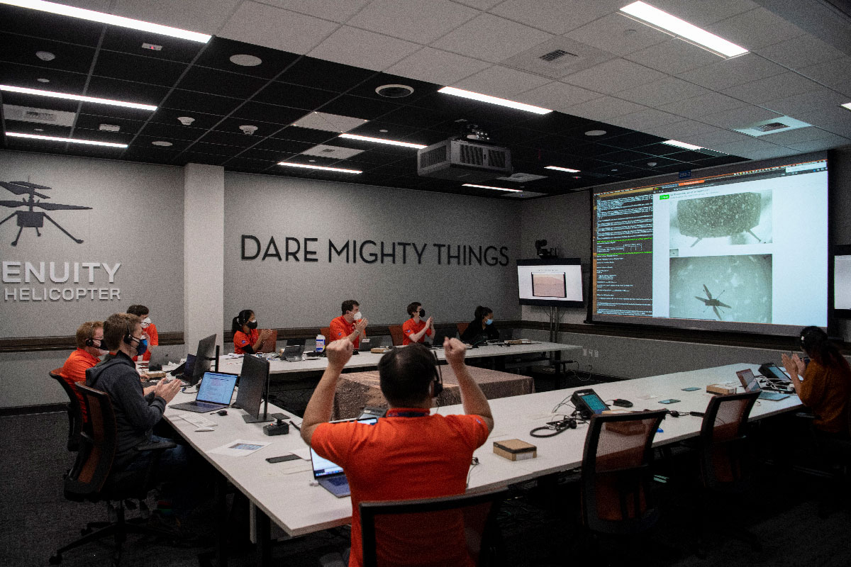 Members of NASA’s Ingenuity Mars Helicopter team at the agency’s Jet Propulsion Laboratory react to data showing that the helicopter completed its second flight on the Red Planet on April 22, 2021.
