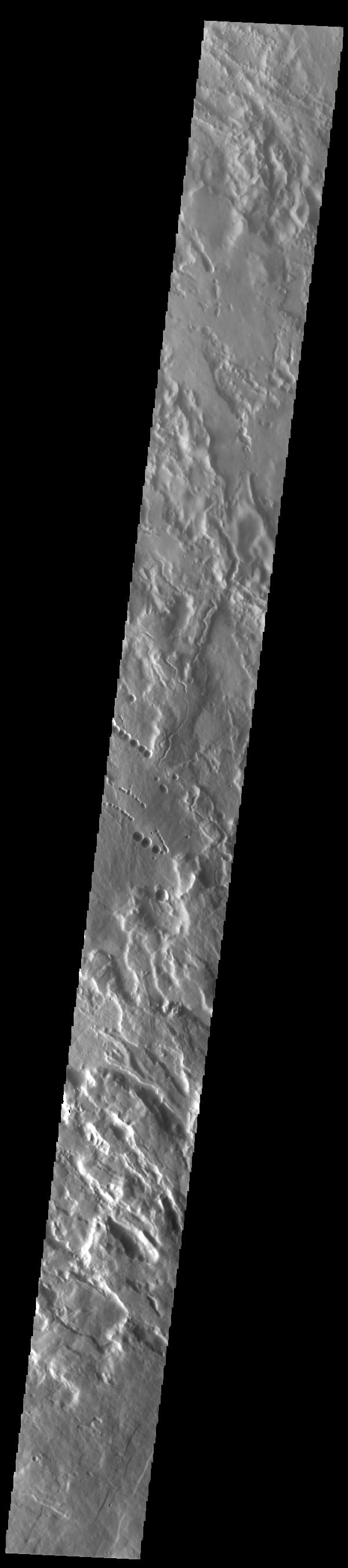 This image from NASAs Mars Odyssey shows Arsia Mons, the southernmost of the Tharsis volcanoes.