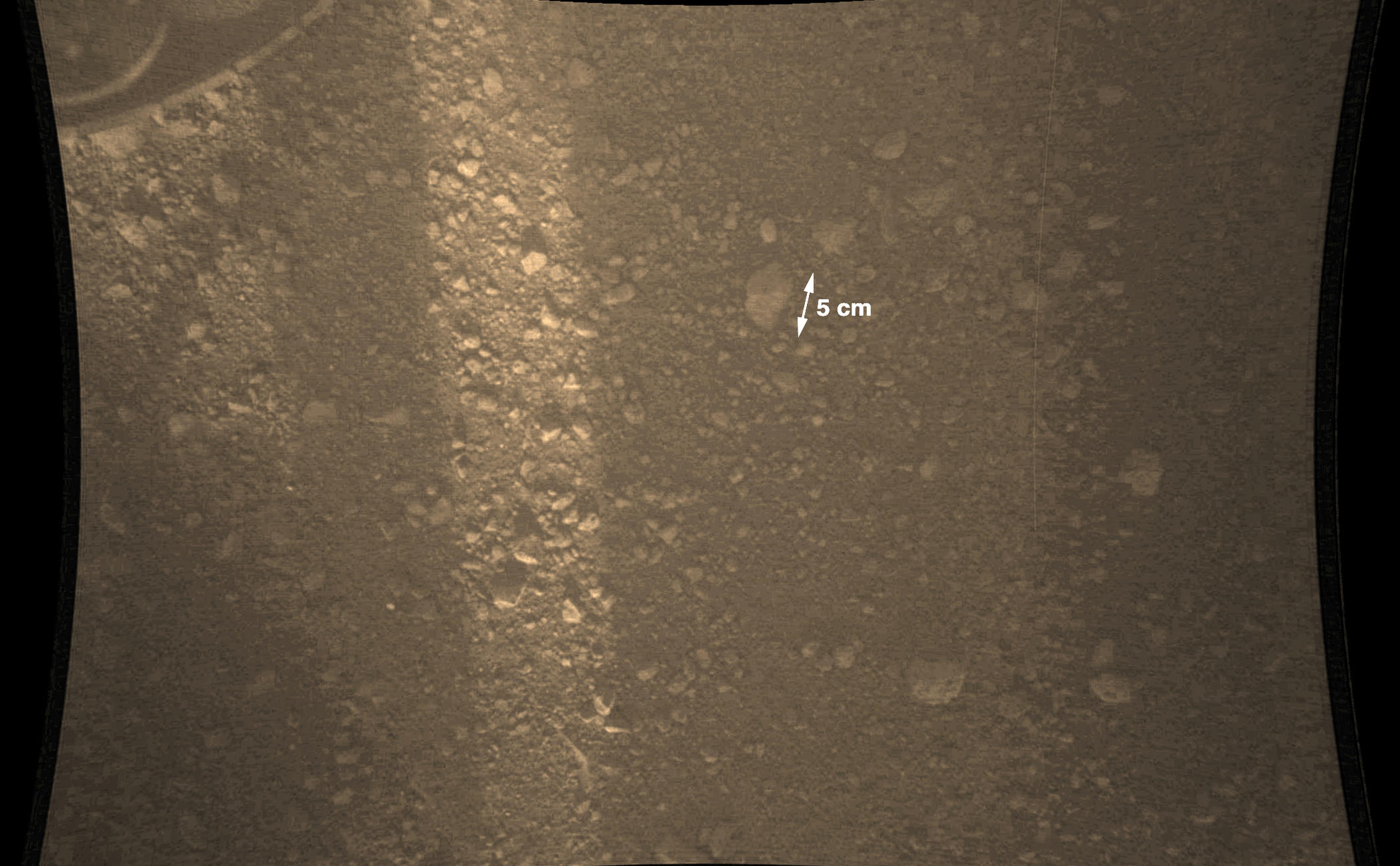 This full-resolution color image from NASA's Curiosity Rover shows the gravel-covered surface of Mars. It was taken by the Mars Descent Imager (MARDI) several minutes after Curiosity touched down on Mars.